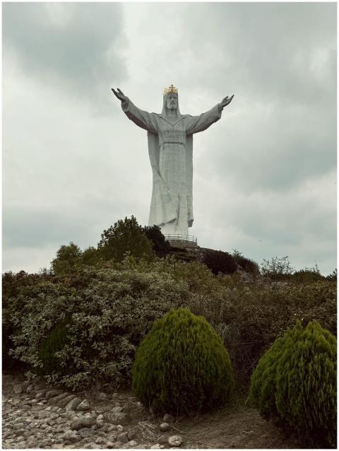 Majestic Christ the King statue rising above lush