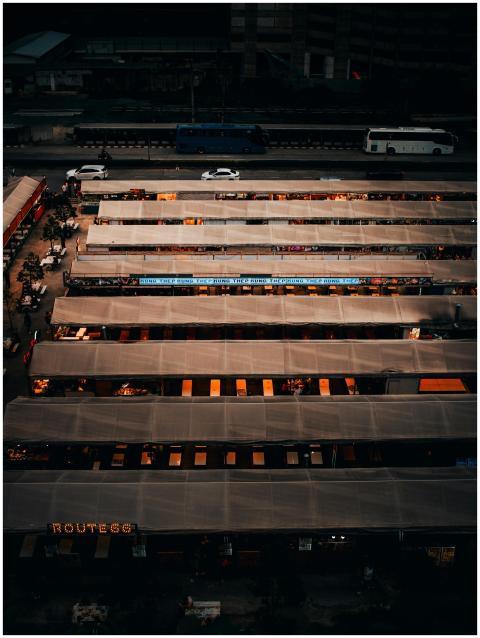 Aerial shot of bustling night market stalls in urb