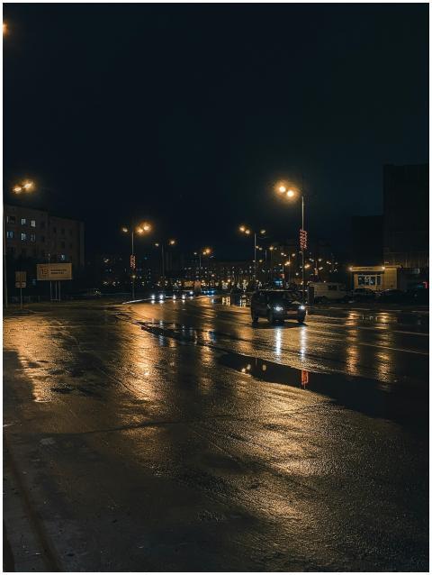 A moody nighttime street scene showcasing reflecti