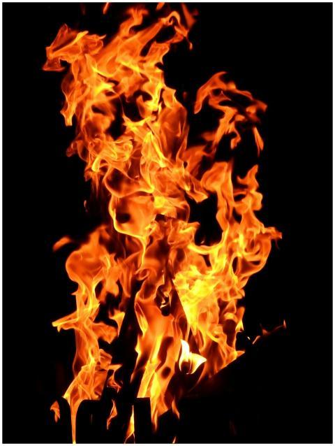 Close-up fiery blaze with vibrant orange flames cr