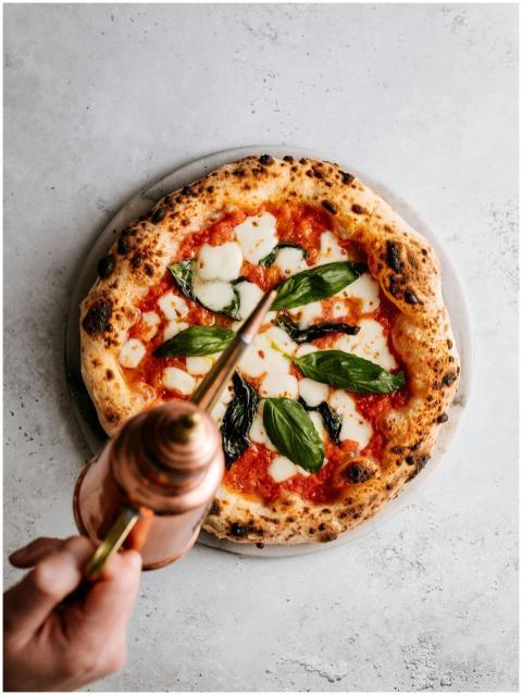 Delicious Italian pizza topped with mozzarella, ba