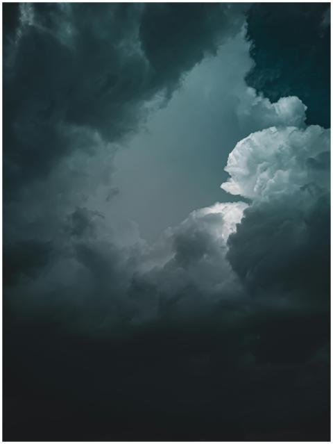 Stunning photograph of dramatic dark clouds formin