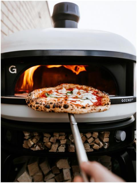 Freshly baked Neapolitan pizza in a wood-fired ove