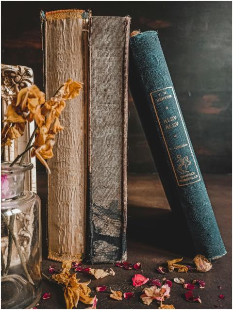 A charming arrangement of vintage books with dried