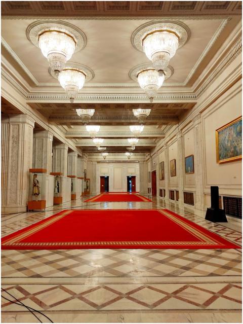 Luxurious interior hallway with a red carpet in a