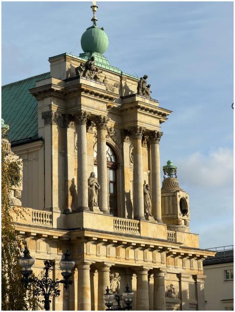 Elegant facade of historic Warsaw church with scul
