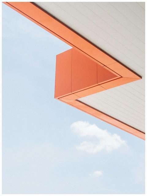 Minimalist architecture with orange angles against