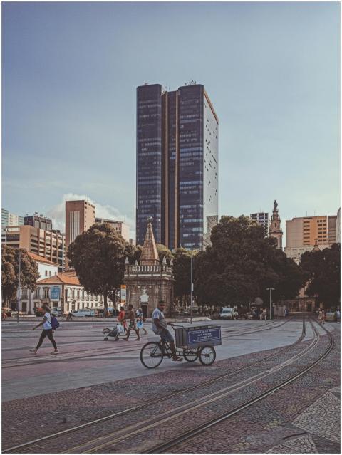Anonymous ethnic people on roadway with tramways a