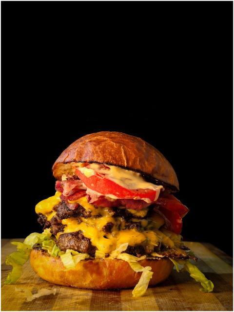 Mouthwatering gourmet cheeseburger with bacon, che
