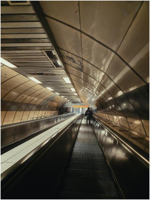 A long escalator inside an Istanbul subway station