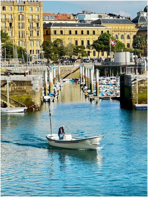 A serene scene of a lone boat navigating the pictu
