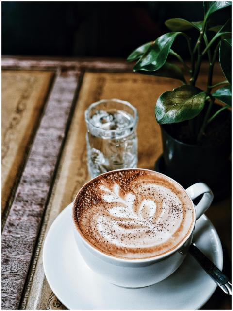 A delicious cappuccino with latte art on a rustic
