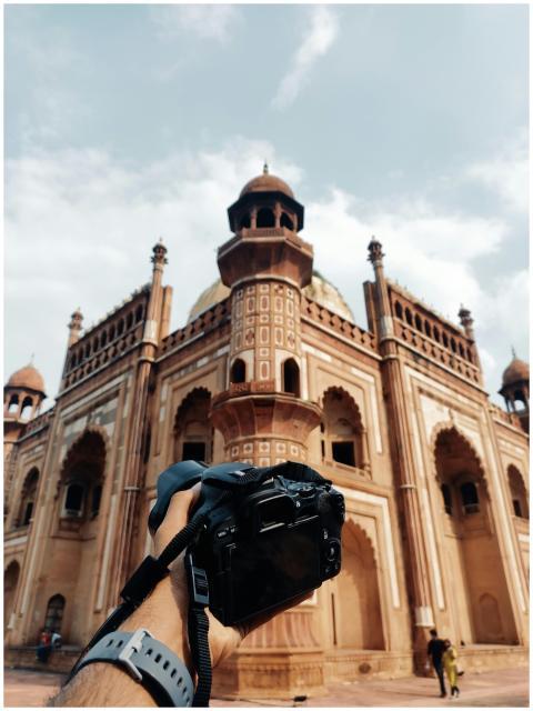 A photographer capturing the iconic Safdarjung Tom