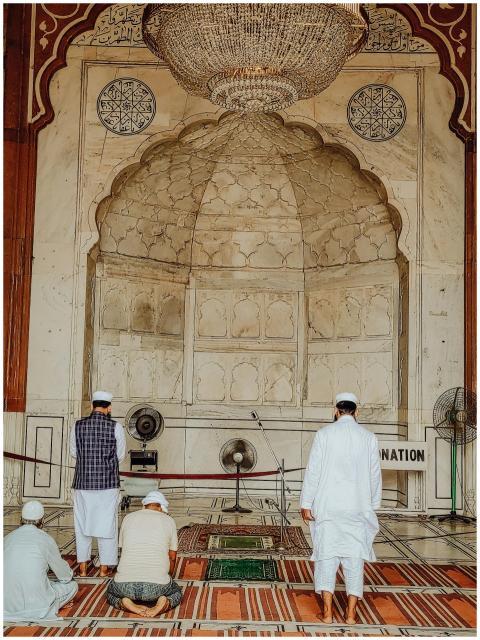 Men engaged in prayer at Jama Masjid mosque in New