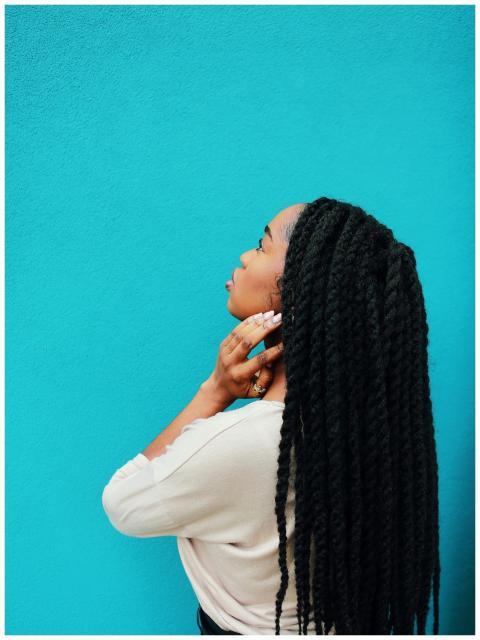 A stylish portrait of an adult woman with braided