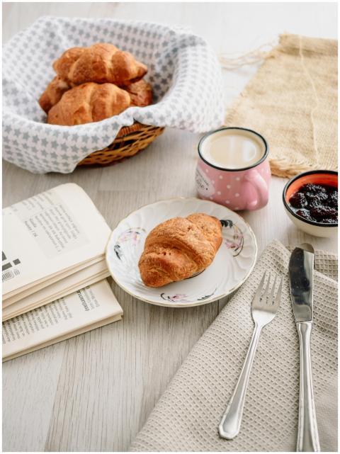 A cozy indoor breakfast setting featuring croissan
