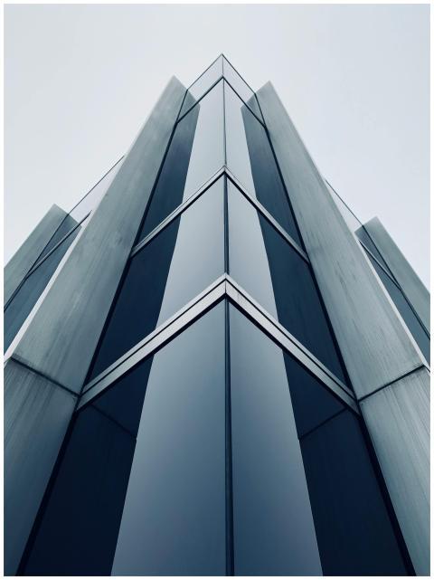 Low-angle shot of a sleek, modern skyscraper in Zü