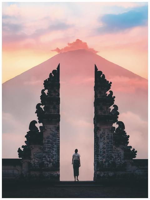 Serene sunrise view of a person standing at Lempuy