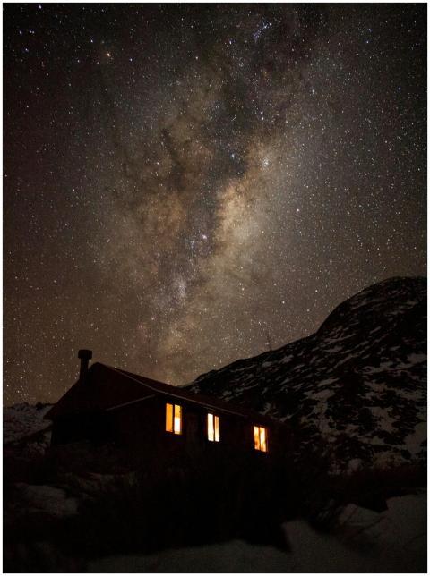 Stunning starry night sky over a remote cabin in t