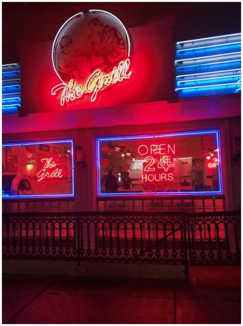 Iconic diner in Athens, GA, lit by vibrant neon si