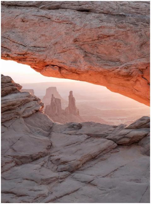 Stunning sunrise view through Mesa Arch in Canyonl