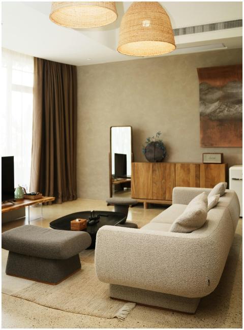 A modern cozy living room featuring plush furnitur