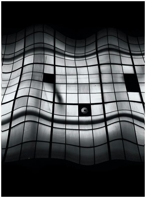 Curved architectural grid in monochrome presenting