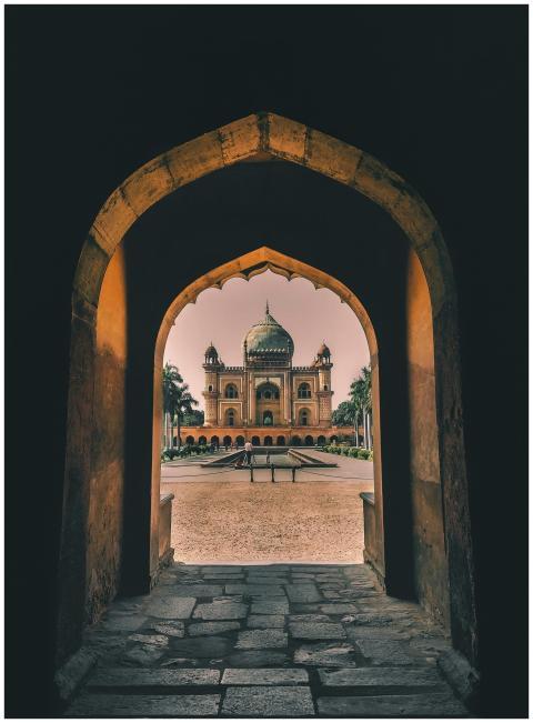 View through an arched hallway towards the histori