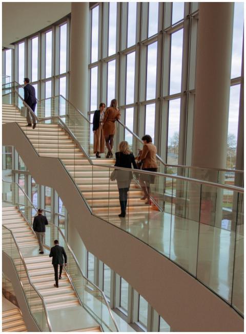 Individuals on a contemporary staircase in a moder