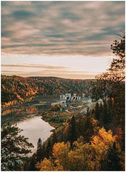 A breathtaking autumn landscape featuring a dam an