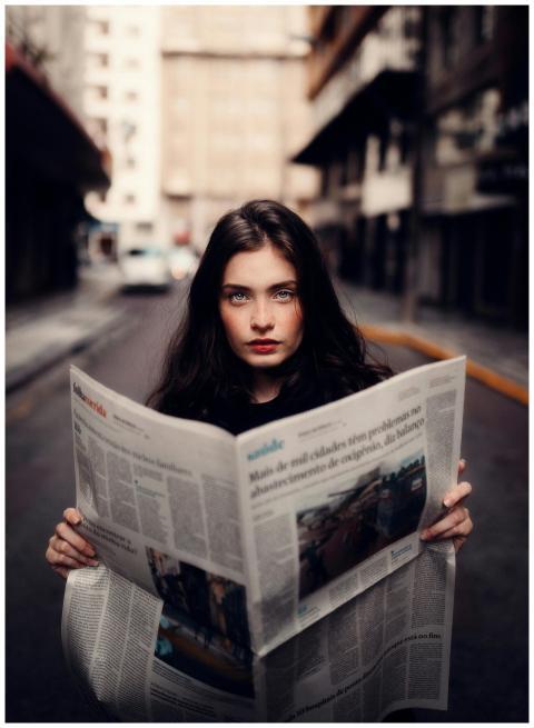 Portrait of a woman standing in an urban street ho