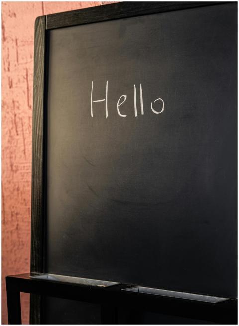 Chalkboard with the word 'Hello' written in chalk,