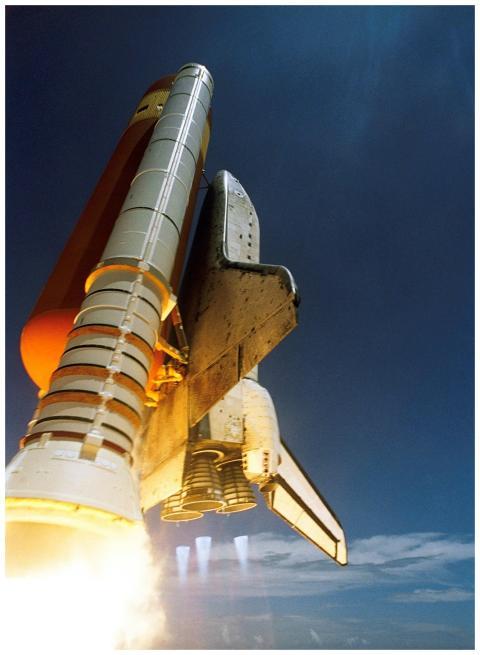 Dynamic low angle view of a space shuttle launch h