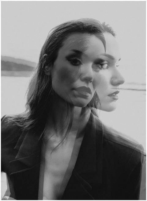 Double exposure black and white portrait of a woma