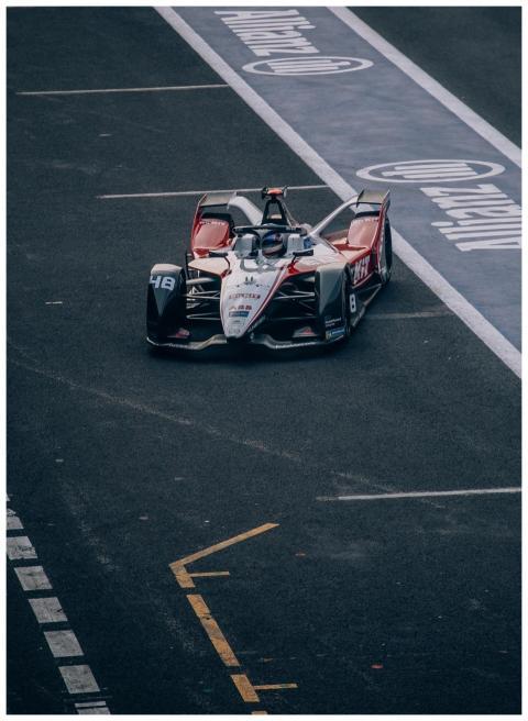High-angle view of a Formula E race car on a track