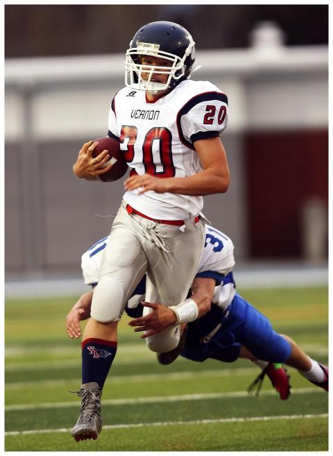 Dynamic shot of high school football players durin