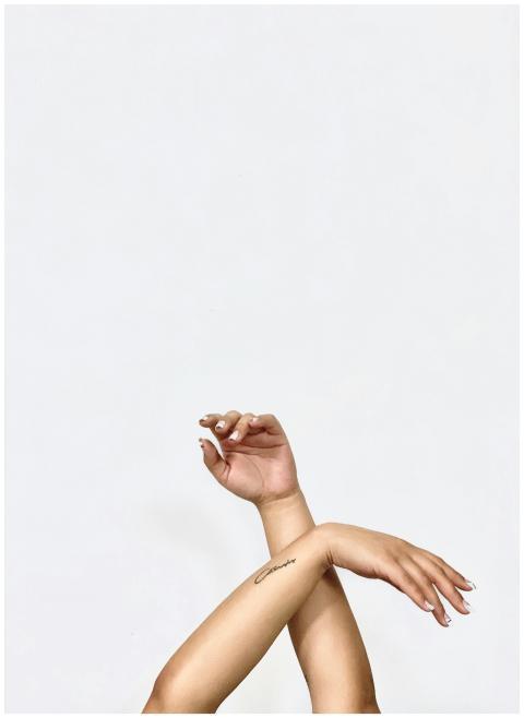 Artistic display of graceful hands crossed on a mi