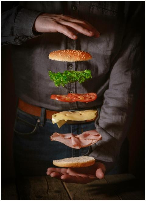 Dynamic shot of a deconstructed sandwich with floa