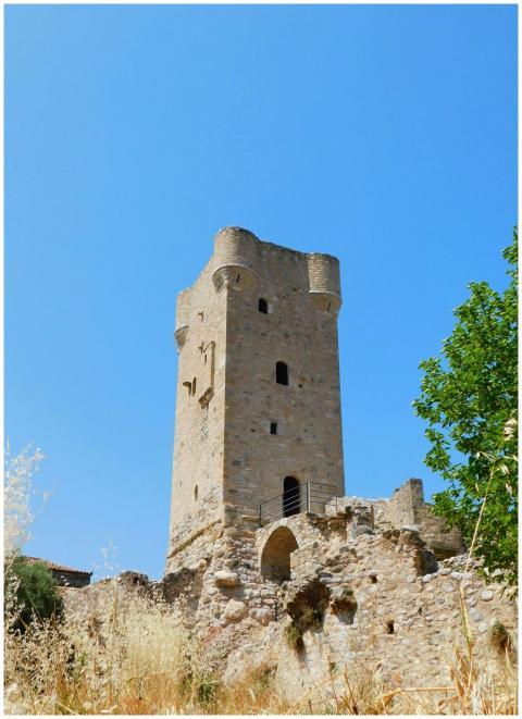 Stone tower in Peloponnese, Greece under clear blu