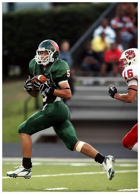 Dynamic scene of football players in motion during