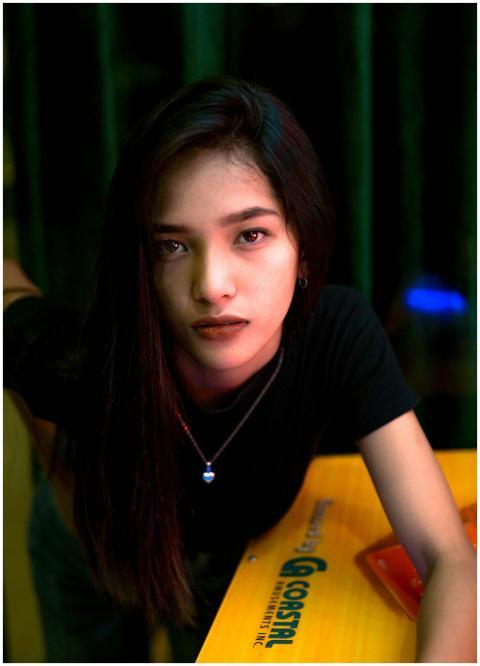 Captivating close-up portrait of a woman in a blac