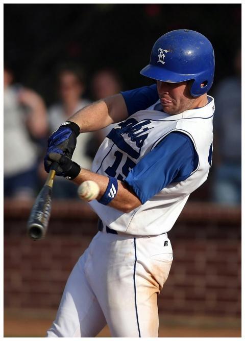 Dynamic shot of a baseball player swinging a bat d