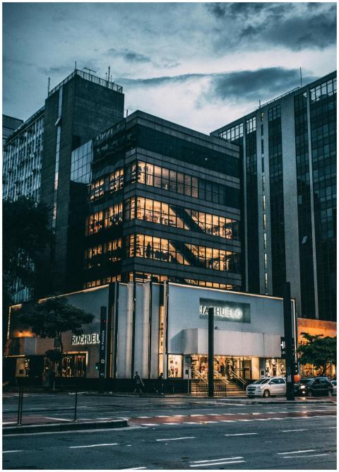 Night view of a city block with illuminated store,