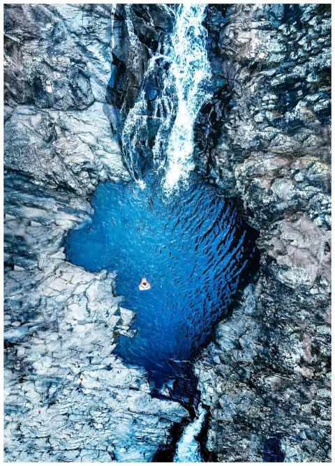Stunning aerial shot of a crystal-clear blue water