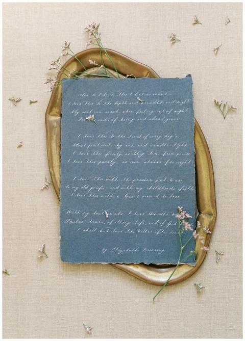 Blue paper letter with elegant handwriting and flo