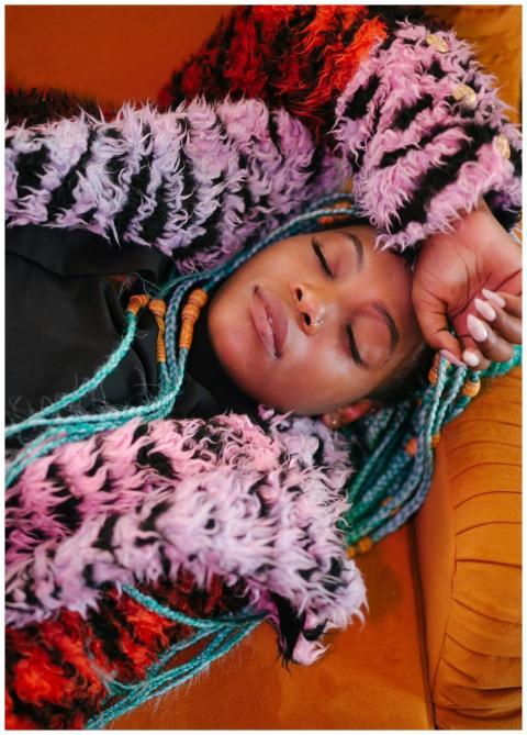 Serene portrait of a woman resting comfortably in