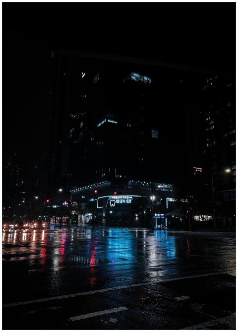 A rainy night in downtown Seoul with urban reflect