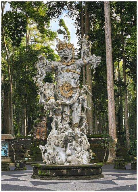 A detailed stone sculpture with golden accents in