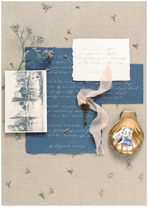 Artistic flat lay with vintage paper, key, and cal