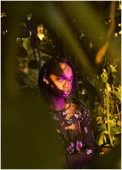 Portrait of a woman in a floral setting, blending